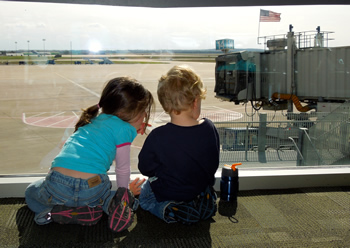 Stella and Romolo Awaiting our First Plane!