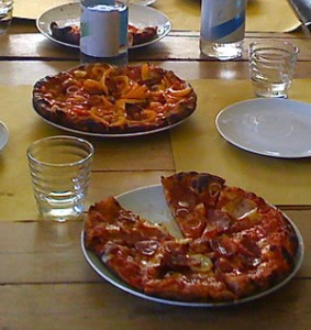 Pizza with mozzarella, prosciutto, potatoes, peppers!